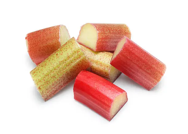 Small pile of rhubarb chunks isolated on white.