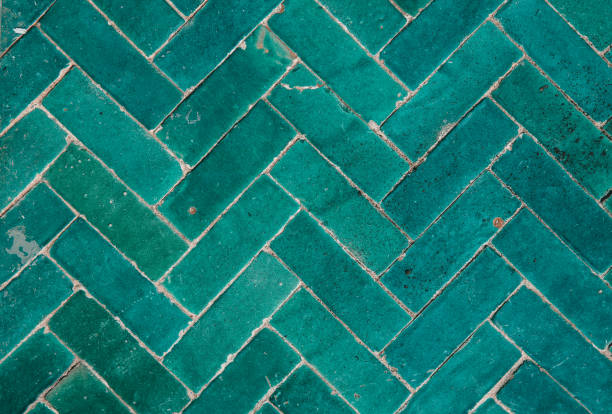 istock Marrakech green blue glazed tiles mosaic herringbone pattern on floor of Moroccan Riad 1701128227