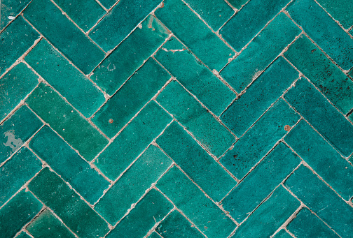 Texture of a shabby, dirty light blue tiles.
