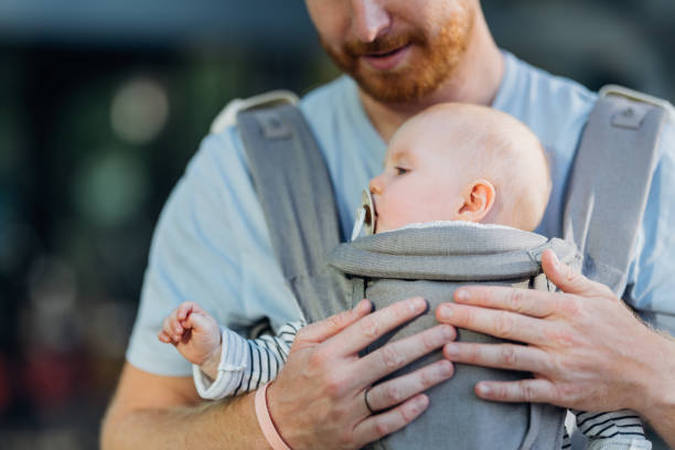 istock Urban Parenthood: Father and Baby on the Move 1701129937