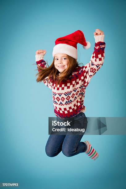 Santas Happy Little Helper Jumping For Joy Stock Photo - Download Image Now - Christmas, Child, Jumping