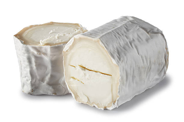 Goats Cheese Cut goats cheese isolated on white. portion cut out cheese part of stock pictures, royalty-free photos & images