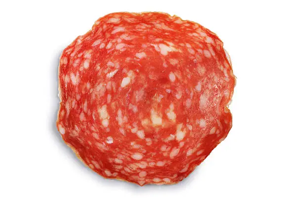 Sliced chorizo sausage isolated on white.