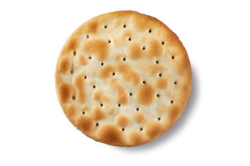 Single water biscuit isolated on white.