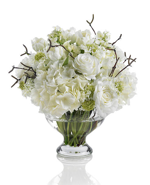istock White bouquet with roses, hydrangeas and dogwood on white background 170115707