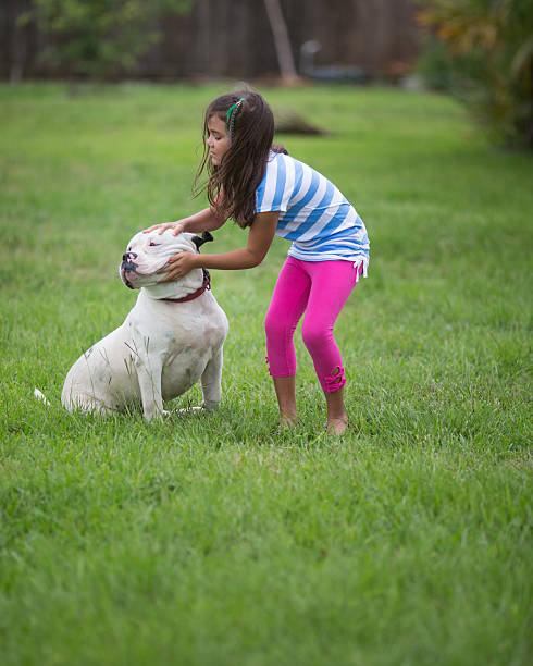 istock little girl and dog 170115741