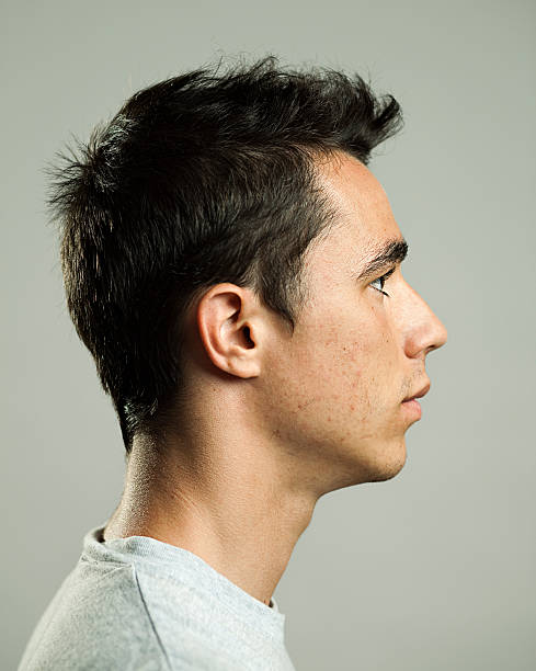 Real man profile Profile view of a real man. rockabilly hair men stock pictures, royalty-free photos & images