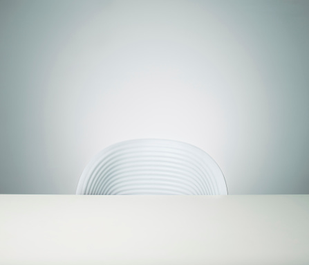 Empty office chair and table in white.