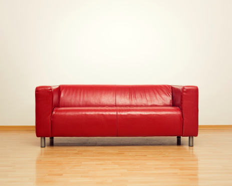 Modern red sofa for two persons.