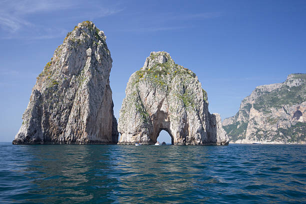Faraglioni in Capri, Italy The rock formations off Capri, widely known as the Faraglioni stack rock stock pictures, royalty-free photos & images