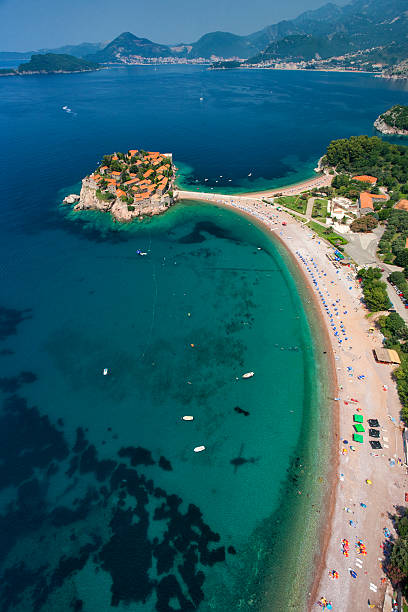 Sveti Stefan Island, Montenegro (aerial view) Aerial photo of Sveti Stefan (St. Stefan) island, an luxury resort famous for its traditional architecture, located on the coast of Adriatic Sea, near Budva city, Montenegro, Europe. Photo was taken from the helicopter. budva stock pictures, royalty-free photos & images