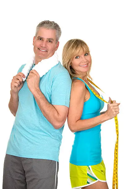mature couple in sports wear as health fitness and weight loss concept