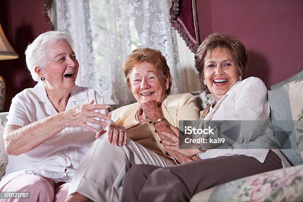 Elderly Women On Living Room Sofa Stock Photo - Download Image Now - Senior Adult, 1980-1989, Friendship