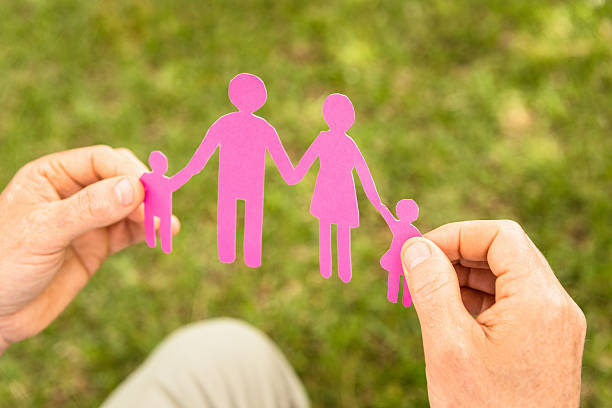 istock Holding a paper doll family 170123057