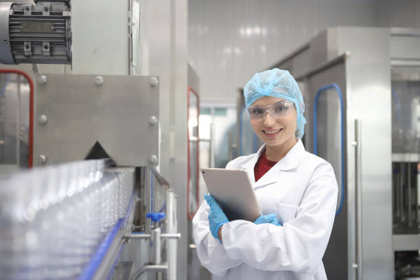 istock Team worker produces drinking water in a clean drinking water plant. drinking water production line 1701243657