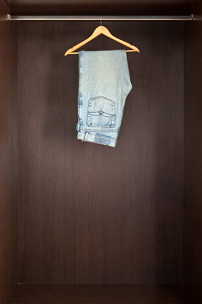 istock Denim jeans hanging in closet 170125666