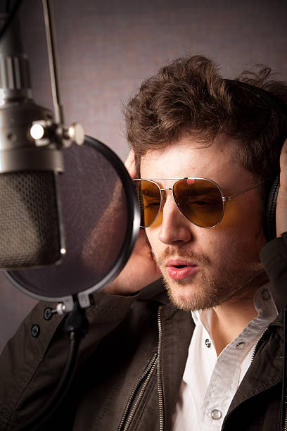 istock Singer Wearing Sunglasses in a Recording Studio 170127734