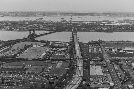 Black and white railroad depot. Industrial district in Brno, Czech Republic. High angle of view. Background wallpaper. Wagons transporting cars. Pollution.