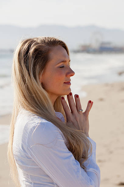 istock Beautiful woman praying 170129499