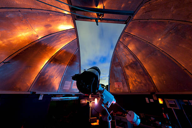 View from an observatory A telescope in a domed observatory at the Norman Lockyer Observatory, Sidmouth, UK telescopic equipment stock pictures, royalty-free photos & images