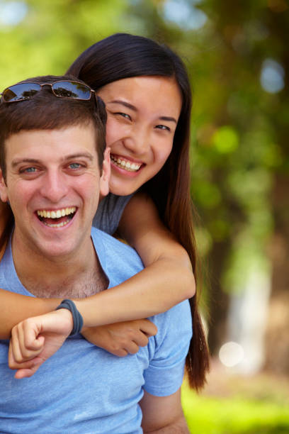 istock Happy young man with lovely Chinese girlfriend 170132224
