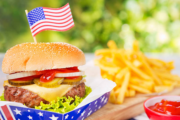 istock Burger with fries on an outdoor table in bright light 170132268
