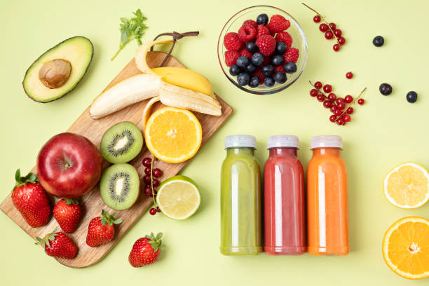 healthy fresh fruit and vegetable smoothies with assorted ingredients - blender apple banana color image imagens e fotografias de stock