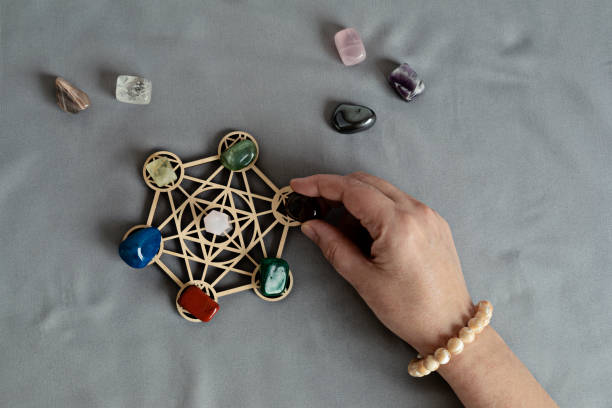 istock Healing chakra crystal grid therapy. Rituals with gemstones for wellness, healing, meditation 1701335560
