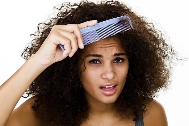 Woman Trying To Comb Her Frizzy Hair Stock Photo - Download Image Now -  Curly Hair, Tangled Hair, Women - iStock