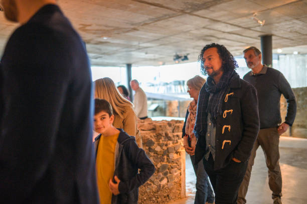 istock Curious Boy in a Group of Tourists 1701351078