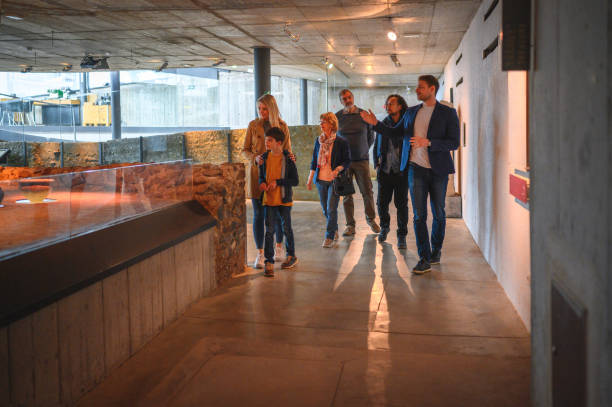 istock Male Museum Guide With Group of Visitors 1701351621