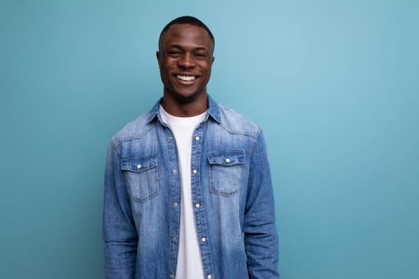 istock kind friendly young american man in denim clothes on blue background with copy space 1701352749