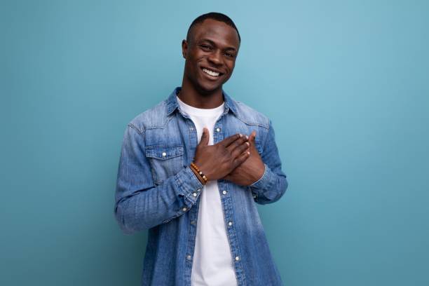istock kind friendly young american man in denim clothes on blue background with copy space 1701352760