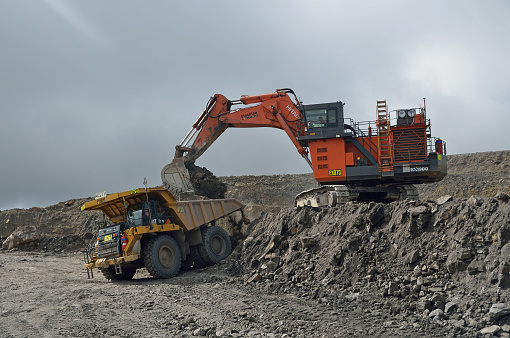 Westport, New Zealand, August 31, A 190 ton digger loads a 130 ton truck with rock overburden at Stockton open cast coal mine on August 31, 2013 near Westport, New Zealand. Stockton is the country's largest open cast coal mine.