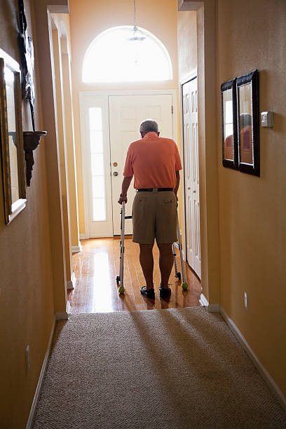 istock Senior man with walker at home 170137880