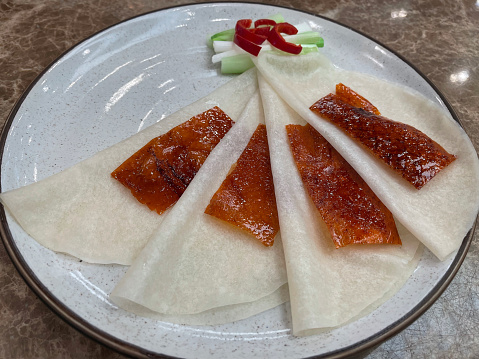 Peking duck served with spring onion and sliced cucumber - Chinese food style