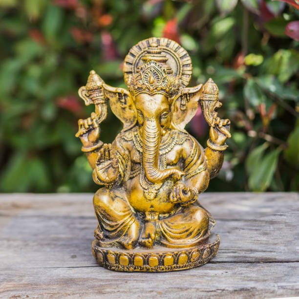 istock Ganesha statue sitting in meditating yoga pose on a trunk. 1701383538