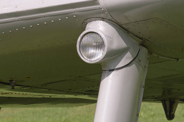 istock Close-up of an old airplane wing and lamp. rivet texture 1701404567