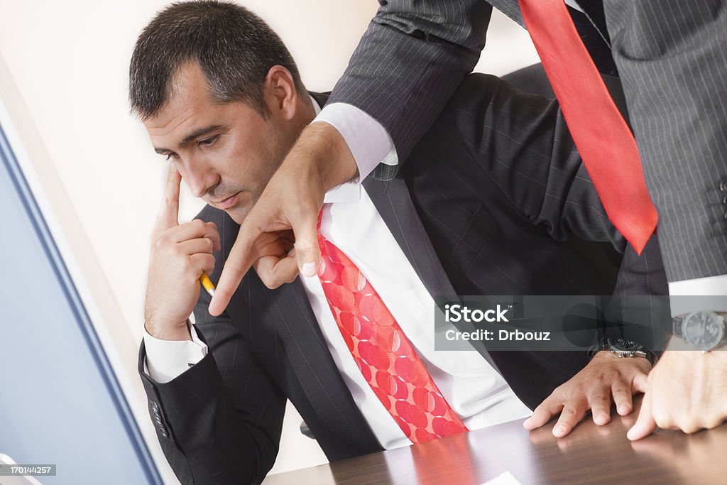 Business talk two business man discussing some business plan, sitting in office; having really worried expressions on their faces; Adobe RGB color space; 25-29 Years Stock Photo