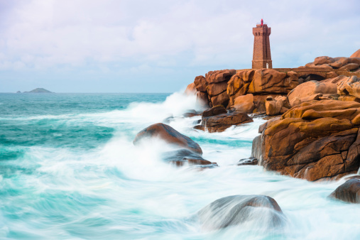 The famous lighthouse at the Cote de Granit rose in the surrounding of Ploumanach in Brittany/France.
