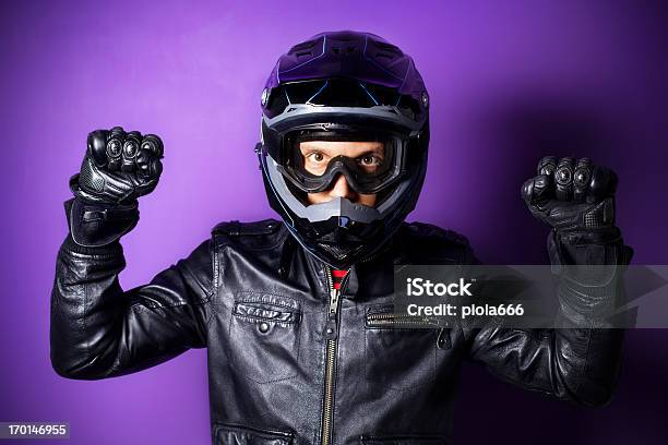 Foto de Motocross Com Capacete Piloto De Motocicleta Enduro Levantou Os Punhos e mais fotos de stock de Capacete - Capacete esportivo