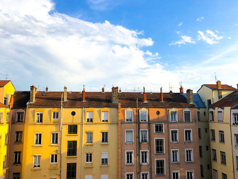 Lyon, France: Colorful 19th-century apartment building in central Lyon, 2nd arrondissement, at dusk.