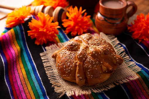 Pan de Muerto. Typical Mexican sweet bread with sesame seeds, that is consumed in the season of the day of the dead. It is a main element in the altars and offerings in the festivity