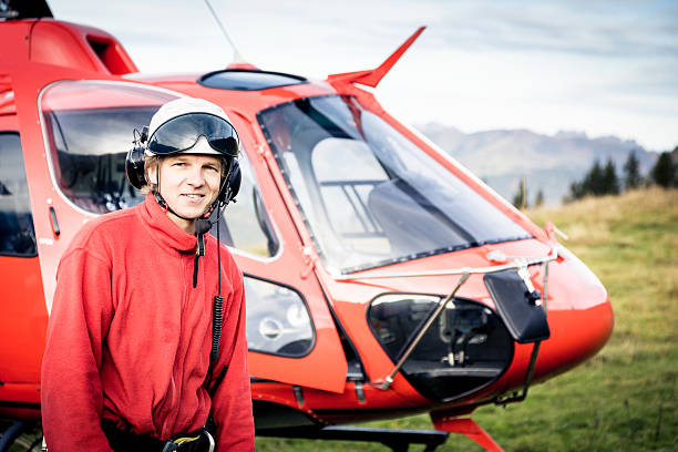 istock paramedic standing by his helicopter 170153683