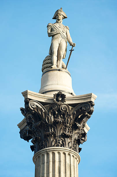 London Trafalgar Square Nelson's Column Blue Sky Close up of Nelson's Column in Trafalgar Square, London  admiral nelson stock pictures, royalty-free photos & images