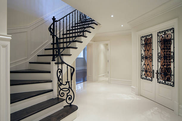 New Mansion Hallway Hallway Interior of brand new mansion residence in North America. house railing stock pictures, royalty-free photos & images