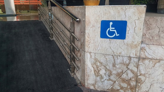 Entrance of office for disable people with sign