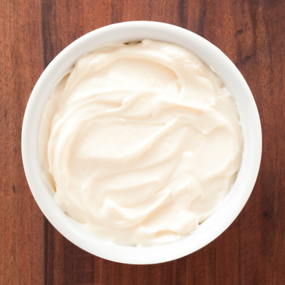 Top view of white bowl full of  cream cheese