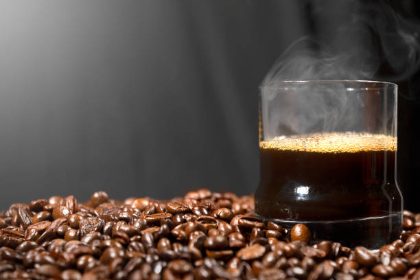 istock A cup of hot coffee with coffee beans 1701561442