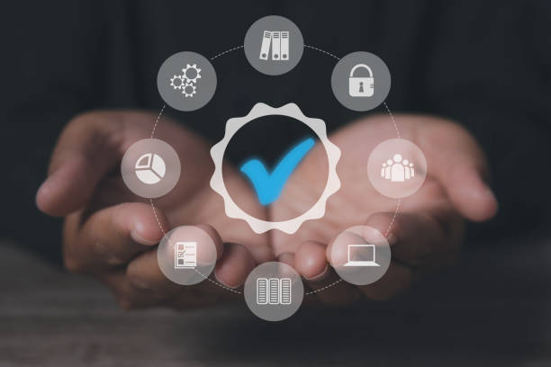 istock Man holding quality assurance icon or QA and Quality Control or QC. 1701578529